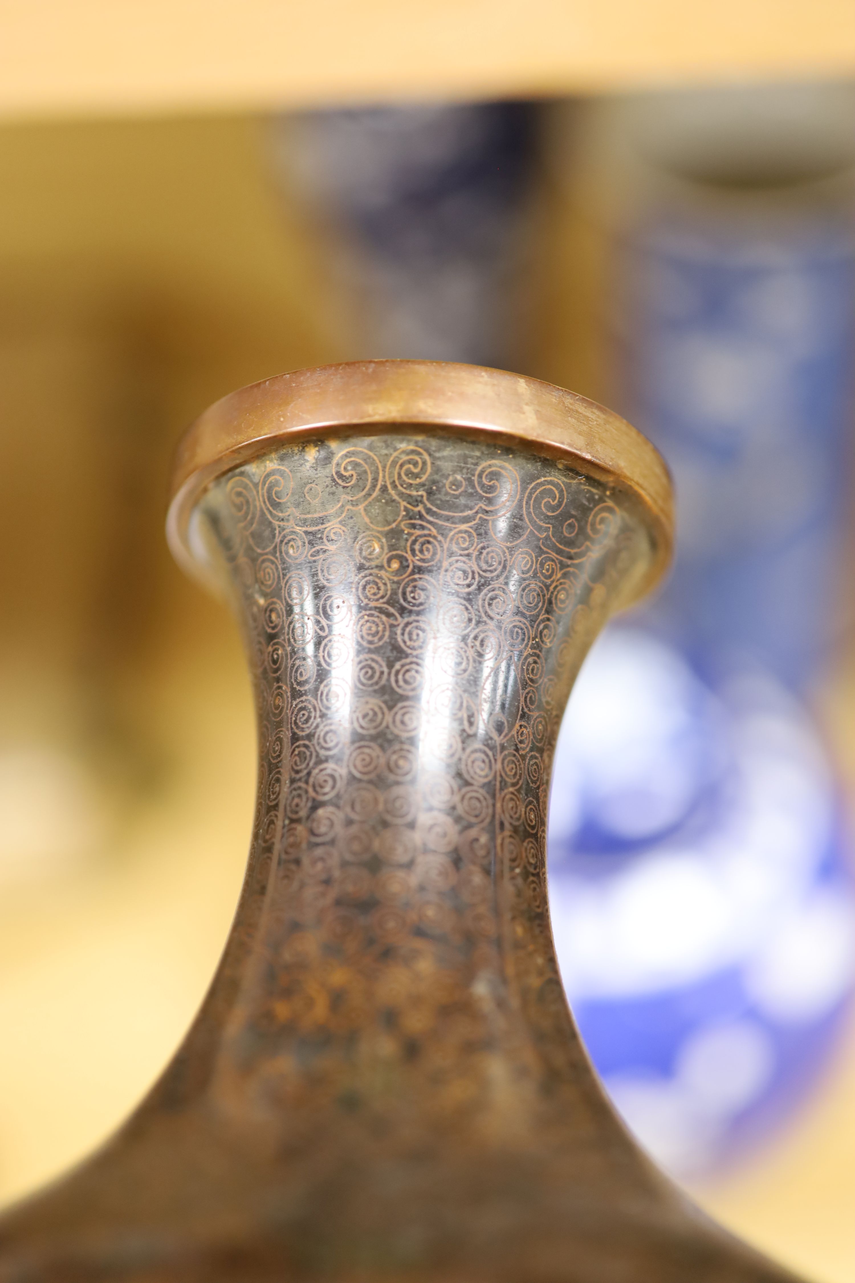 A Chinese blue and white cylindrical vase, another vase and cover and a blue and white jar and cover, together with a cloisonne vase and a bronze censer, tallest 32cm